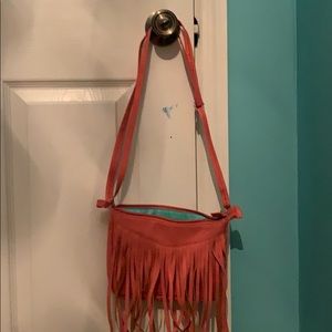 A pink shoulder purse